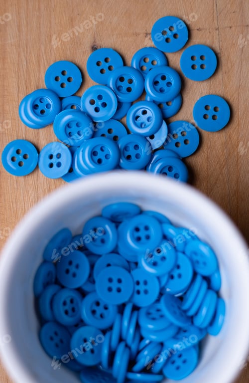Preview: Blue button on wooden table