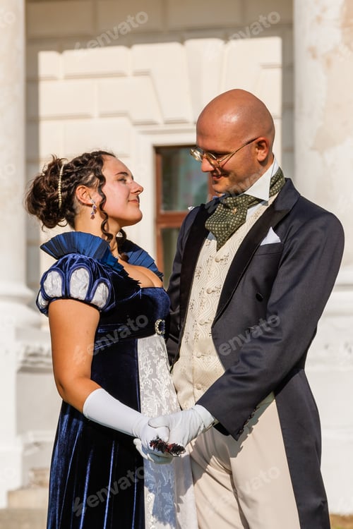 Preview: Beautiful girl with a guy in vintage attire on the background of the castle