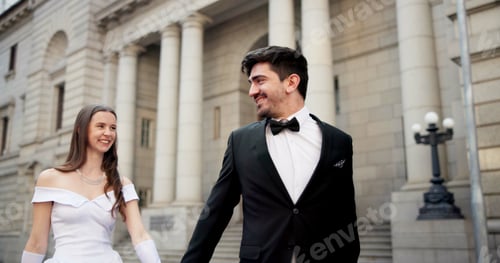 Preview: City, building and couple at wedding with smile, walking and bride with groom in street together. U