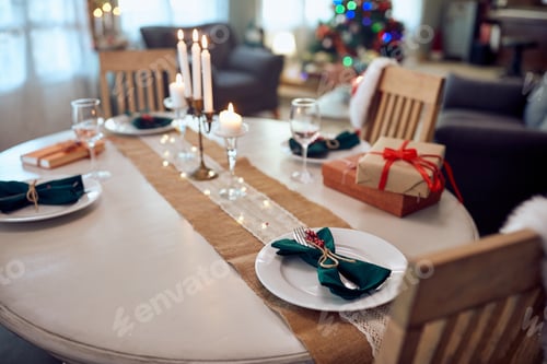 Preview: Decorated dining table on Christmas day at home.