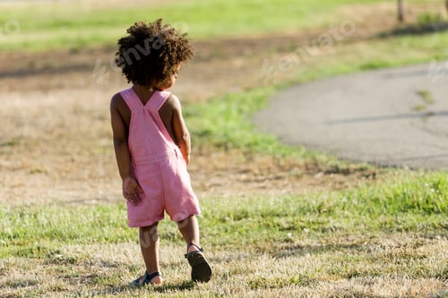 Preview: African american baby having fun in the park.