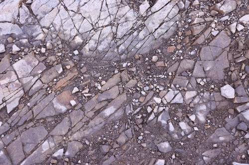 Preview: Background of shattered stony stones surface in mountain area. Texture with natural light
