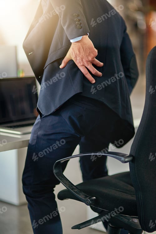Preview: The painful truth of poor posture. Shot of a businessman suffering from back pain.