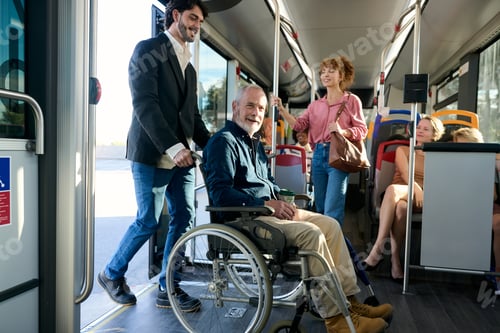 Preview: Man helping disabled senior entering public bus