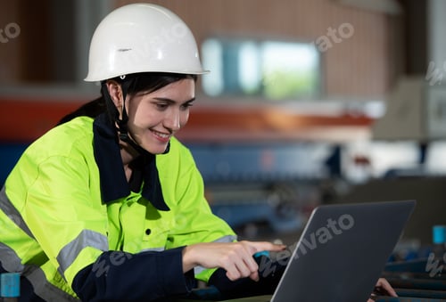 Preview: Portrait of a heavy equipment female engineer from a huge industry