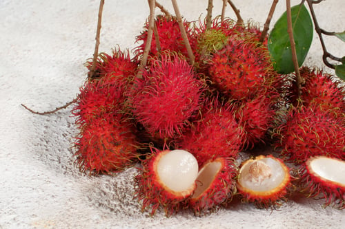Preview: Fresh and ripe rambutan sweet tropical fruit on white background