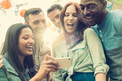 Preview: A group of friends gathering to take a group selfie.
