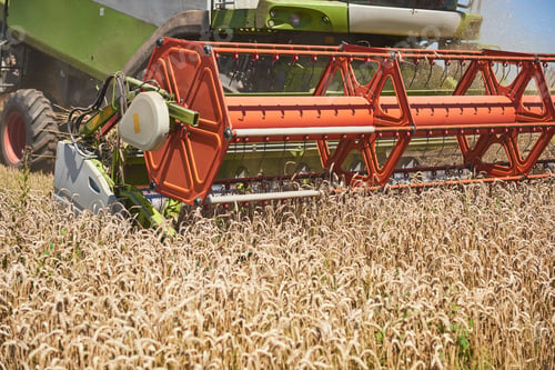 Preview: close view of modern combine harvester in action