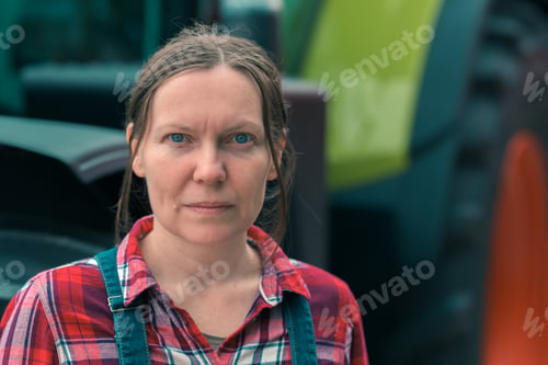 Preview: Female farmer and agricultural tractor
