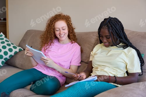 Preview: Students studying together on sofa, preparing for exams