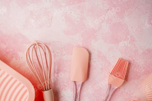 Preview: Pink silicone baking utensils on textured pink background