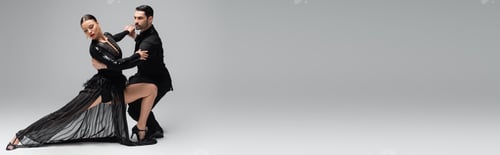 Preview: Ballroom dancers performing tango on grey background with copy space, banner