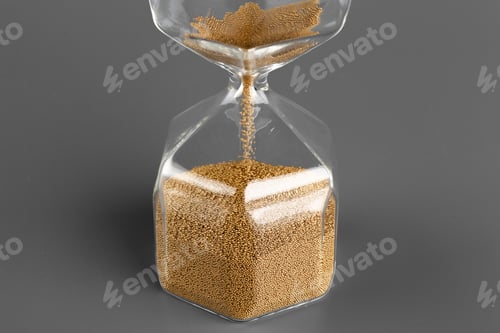 Preview: Hourglass with sand on gray background close up