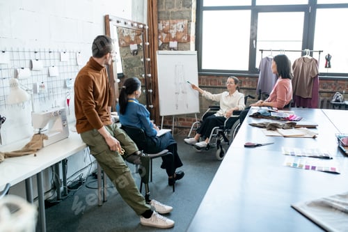 Preview: Contemporary designers looking at whiteboard during presentation