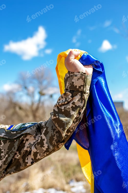 Preview: Armed Forces of Ukraine. Ukrainian soldier. Military uniform. Ukrainian flag. Close up