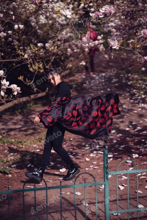 Preview: Beautiful young woman wearing kimono with cherry blossoms, sakura view