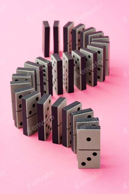 Preview: Row of domino tiles on pink studio background