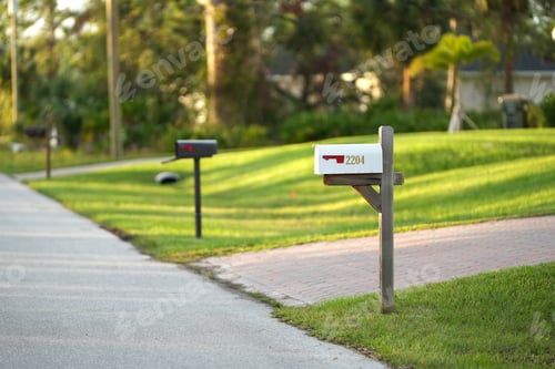 Preview: Typical american outdoors mail box on suburban street side