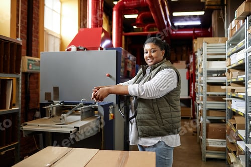 Preview: Smiling Female Worker at Print Factory