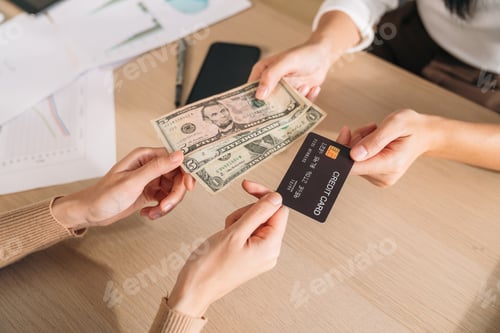 Preview: Close up of Happy woman hold card for payment at shop. Female using technology for money transfer.