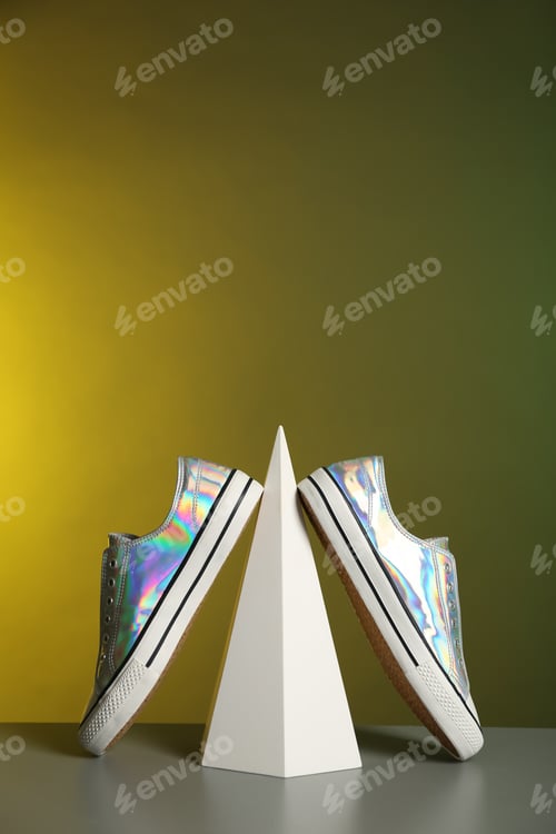 Preview: Composition with stylish shoes on table against color background. Space for text