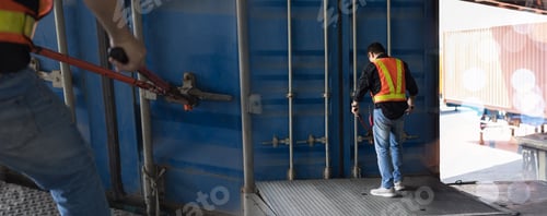 Preview: Warehouse worker Using steel cutting Seal for open A Door Container.