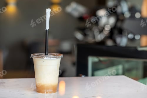 Preview: Icy latte in a takeaway plastic cup