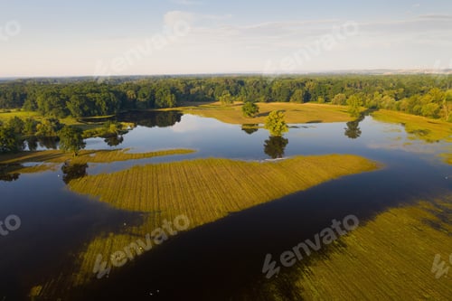 Preview: Water standing still on a flooded meadow from drone