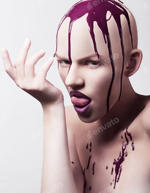 Preview: Hairless woman licking hand covered with paint
