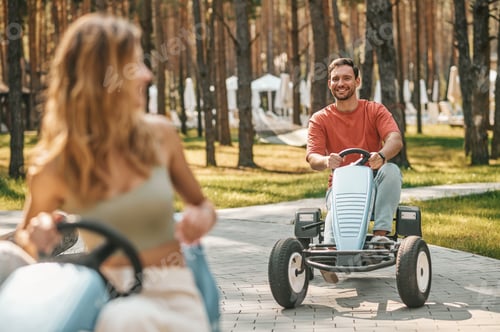 Preview: A young couple having a riding competion and looking enjoyed