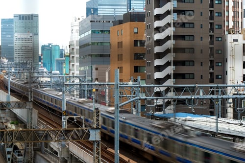 Preview: rain on the JR Yokosuka-Sobu Line passing through Nippori Station in Tokyo, Japan
