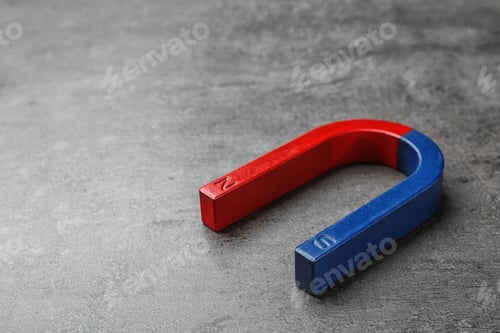 Preview: Red and blue horseshoe magnet on grey background. Space for text
