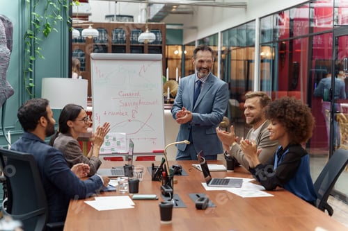 Preview: Mature business coach or speaker make flip chart presentation to diverse businesspeople at meeting