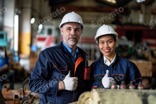 Preview: Maintenance manager meet engineer checking part for repair machine and check hand and smile portrait