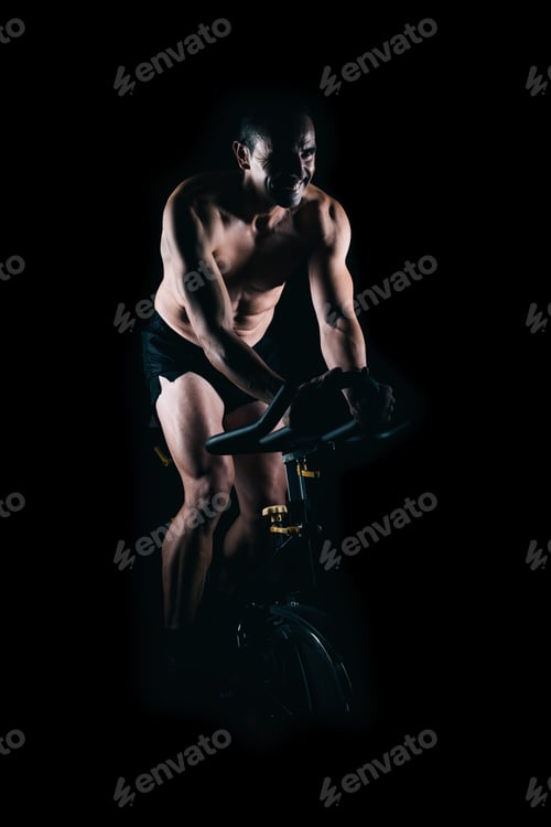 Preview: Strong man using the static bike.