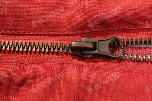 Preview: Red fabric with zipper as background, closeup view