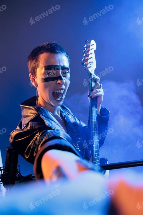 Preview: Crazy performer playing guitar singing loud