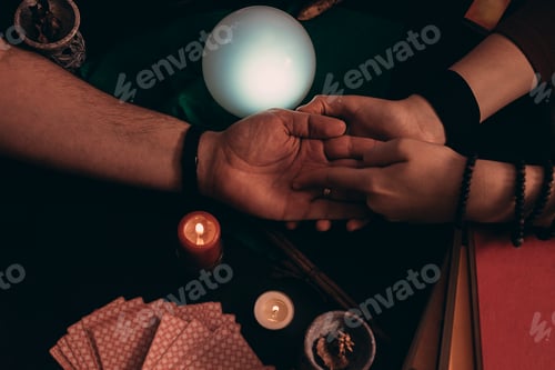 Preview: Pythoness reading the future in the hand of a man.