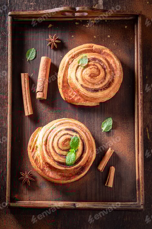 Preview: Cinnamon Rolls on Rustic Wooden Tray with Mint