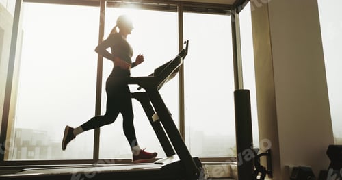 Preview: Active, woman and running on treadmill at gym for cardio exercise, workout and training performance