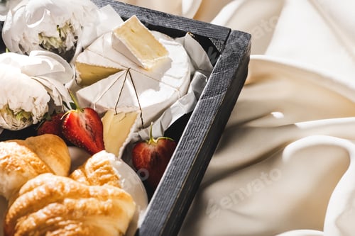 Preview: French Breakfast With Croissant, Camembert, Strawberries on Wooden Tray on White Cloth With Peonies