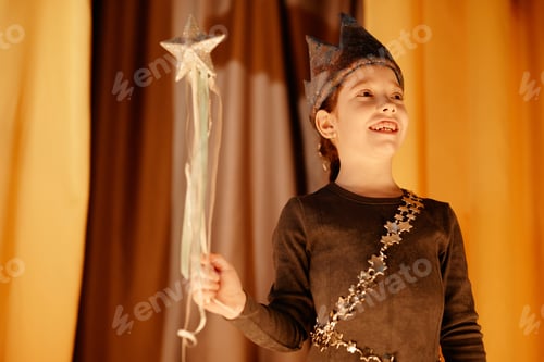 Preview: Smiling Child Holding Star Wand During Performance