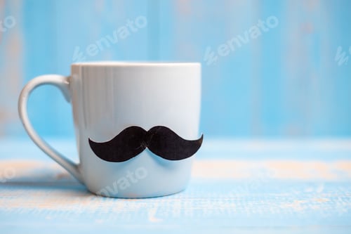 Preview: Blue coffee cup with Black mustache on wood table background in the morning