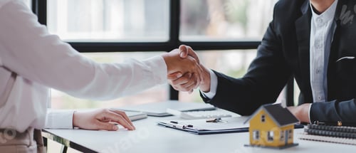 Preview: Handshake real estate agents deliver sample homes to customers. mortgage loan agreement Make a contr