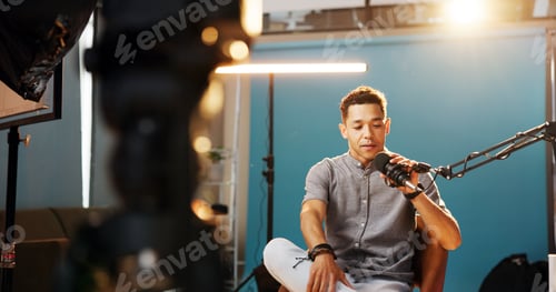 Preview: Audio, podcast and man in studio, host and live streaming with influencer, equipment and content cr