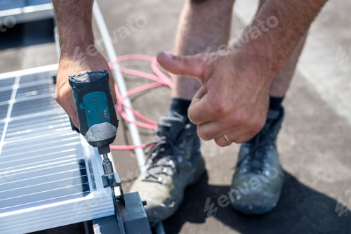 Preview: A person installing a solar panel with precision and care.