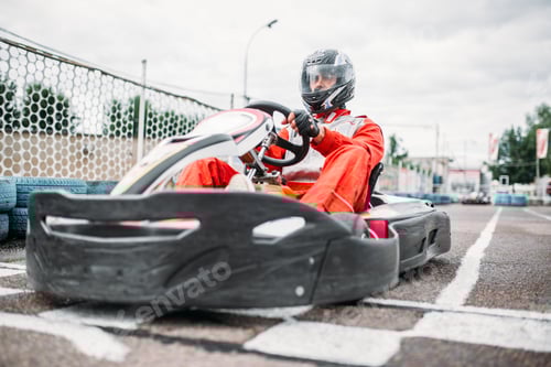 Preview: Focused Man Racing a Go Kart on Track