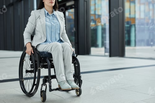 Preview: Young Businesswoman in Wheelchair Outdoors
