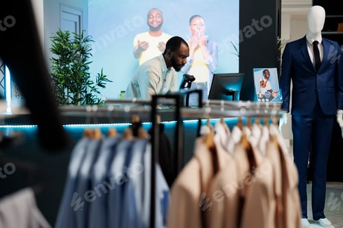 Preview: Cashier working on computer at counter