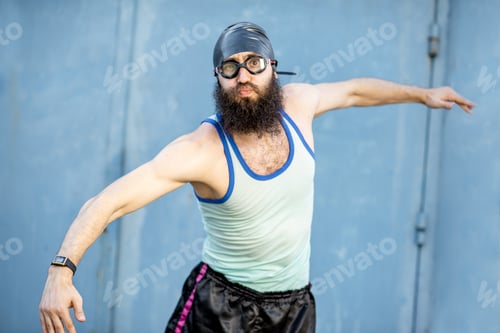 Preview: Portrait of a weird swimmer on the yellow background